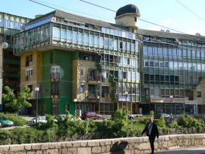 Bosnia-Herzegovina, Sarajevo City: quirky communist era apartment building with shops on