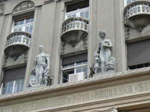 Serbia, Belgrade: family theme socialist statuary on a building
