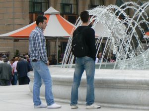 Macedonia, Skopje: typical guys at Macedonia Plaza fountain