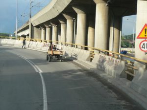 Macedonia, Skopje: Roma horse cart on a highway