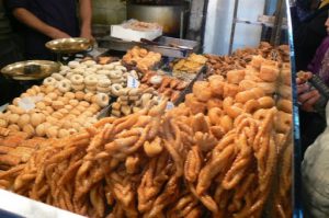 Sticky pastries for sale along the narrow walkways