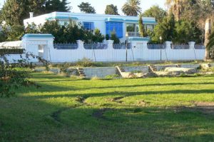 Tunisia: Carthage - modern home with ancient ruins in foreground