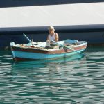 Albania, Saranda city - fisherman in the harbor