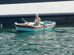 Albania, Saranda city - fisherman in the harbor