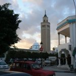 Tunisia, La Marsa - mosque minaret tower and surrounding shops