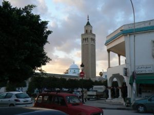 Tunisia, La Marsa - mosque minaret tower and surrounding shops