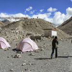 Approaching a huge mound of moraine (rocks and soil)  pushed