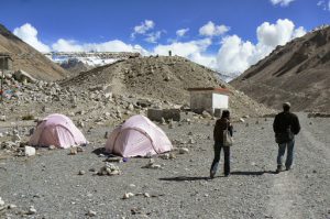 Approaching a huge mound of moraine (rocks and soil)  pushed