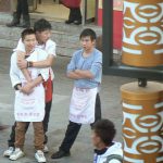 Tibet, Lhasa: good friends and workers at a restaurant in Barkhor