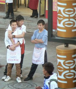 Tibet, Lhasa: good friends and workers at a restaurant in Barkhor