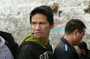 Tibet, Lhasa: handsome visitor waiting in line for Potala Palace