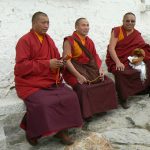Tibet, Lhasa: Potala Palace - monks on the walkway