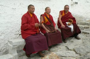 Tibet, Lhasa: Potala Palace - monks on the walkway