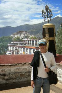 Tibet: Lhasa - Michael atop the Jarkang Temple with Potala Palace