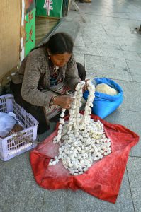Tibet: Lhasa - vendor selling butter squares