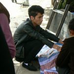 Tibet: Lhasa - young man in the market