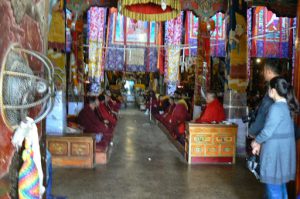 Tibet: Lhasa - Buddhist temple monks chanting