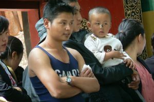 Tibet: Lhasa - young man observing debate