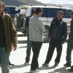 Tibet: tourist car drivers at a pit stop