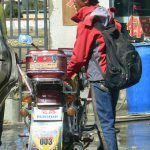 Tibet: Man with motorbike