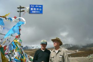 Tibet: Michael and Richard at a mountain road pass  at