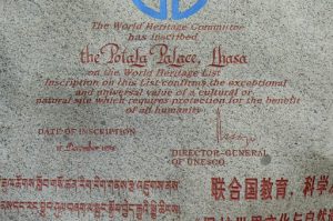Tibet: Lhasa - carved rock in Tibetan, Chinese and English describing