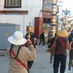 Tibet: Lhasa - Tibetan Quarter of the city; pilgrims walking