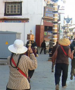 Tibet: Lhasa - Tibetan Quarter of the city; pilgrims walking