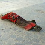 Tibet: Lhasa - Tibetan Quarter of the city;  pilgrim prostrating