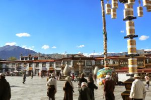 Tibet: Lhasa - Tibetan Quarter of the city; pilgrims walking