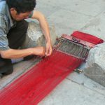 Tibet: Lhasa - Tibetan Quarter of the city;  weaver making