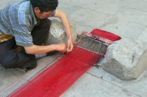 Tibet: Lhasa - Tibetan Quarter of the city;  weaver making