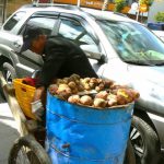 Tibet: Lhasa - Tibetan Quarter of the city;  potato vendor.