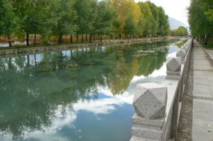 Tibet: Lhasa - Tibetan quarter; a canal surrounds a park.