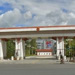 Tibet: Lhasa - entrance to the governing party headquarters; notice Chinese