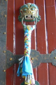 Tibet: Lhasa - Summer Palace Symbolic knot tied to door handle.