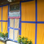 Tibet: Lhasa - Summer Palace Brightly colored curtains mask palace details