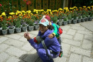 Tibet: Lhasa - Summer Palace Visitor with her child.