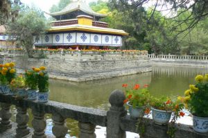 Tibet: Lhasa - Summer Palace Truzing palace surrounded by a moat.