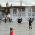 Tibet: Lhasa  Large smoking vat at entry to Jokhang Temple. Pilgrims