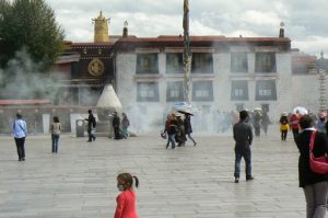 Tibet: Lhasa  Large smoking vat at entry to Jokhang Temple. Pilgrims