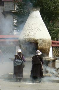Tibet: Lhasa  Large smoking vat at entry to Jokhang Temple. Pilgrims