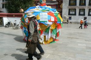 Tibet: Lhasa  Jokhang Temple. Pilgrims walk clockwise around the temple passing prayer
