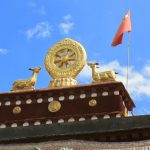 Tibet: Lhasa  Symbolic golden statuary above entry to Jokhang Temple.