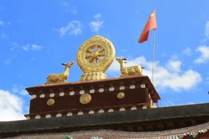 Tibet: Lhasa  Symbolic golden statuary above entry to Jokhang Temple.