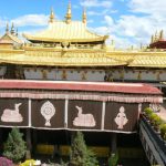 Tibet: Lhasa Golden roof and courtyard tapestries of Jokhang Temple.