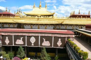 Tibet: Lhasa Golden roof and courtyard tapestries of Jokhang Temple.