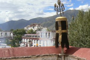 Tibet: Lhasa Distant view of Potala Palace from Jokhang Temple. Sacred juniper