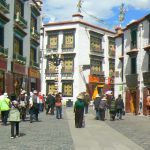 Tibet: Lhasa Outside Jokhang can be seen secular buildings and pilgrims