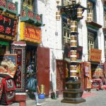 Tibet: Lhasa Outside Jokhang can be seen secular buildings and shops.